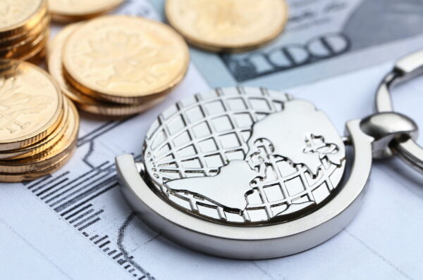 Coins, paper money and globe on white Statistic form background