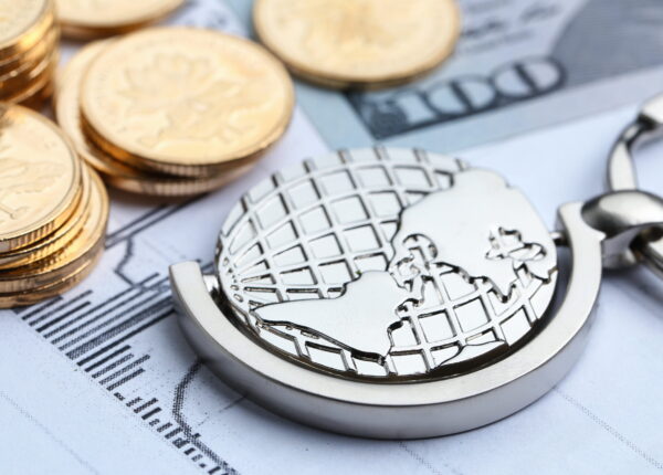 Coins, paper money and globe on white Statistic form background